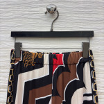 Pucci vintage print set: draped shirt paired with high-waisted wide-leg pants in sizes S, M, and L