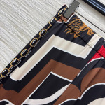 Pucci vintage print set: draped shirt paired with high-waisted wide-leg pants in sizes S, M, and L