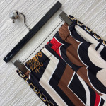 Pucci vintage print set: draped shirt paired with high-waisted wide-leg pants in sizes S, M, and L