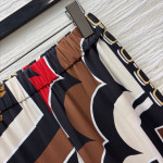 Pucci vintage print set: draped shirt paired with high-waisted wide-leg pants in sizes S, M, and L