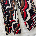 Pucci vintage print set: draped shirt paired with high-waisted wide-leg pants in sizes S, M, and L