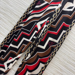 Pucci vintage print set: draped shirt paired with high-waisted wide-leg pants in sizes S, M, and L