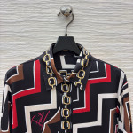Pucci vintage print set: a combination of a draped shirt paired with high-waisted wide-leg pants, featuring contrasting wave patterns and classic chain elements. Shirt in sizes S, M, and L