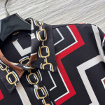 Pucci vintage print set: a combination of a draped shirt paired with high-waisted wide-leg pants, featuring contrasting wave patterns and classic chain elements. Shirt in sizes S, M, and L