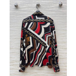 Pucci vintage print set: a combination of a draped shirt paired with high-waisted wide-leg pants, featuring contrasting wave patterns and classic chain elements. Shirt in sizes S, M, and L