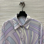 Pucci's purple-toned turtleneck shirt paired with pants, the gentle purple hue evokes a sense of relaxation, with abstract lines outlining a laid-back style. The fabric is smooth and silky, available in sizes S, M, and L