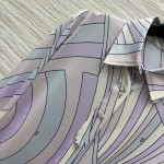 Pucci's purple-toned turtleneck shirt paired with pants, the gentle purple hue evokes a sense of relaxation, with abstract lines outlining a laid-back style. The fabric is smooth and silky, available in sizes S, M, and L