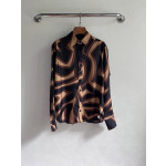 Pucci silk shirt features Labirinto print and is made of 100% heavyweight silk twill. Size options: 36, 38, 40, 42