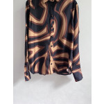Pucci silk shirt features Labirinto print and is made of 100% heavyweight silk twill. Size options: 36, 38, 40, 42
