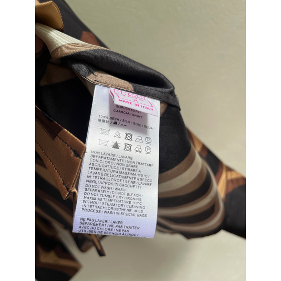 Pucci silk shirt features Labirinto print and is made of 100% heavyweight silk twill. Size options: 36, 38, 40, 42