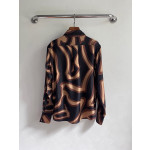 Pucci silk shirt features Labirinto print and is made of 100% heavyweight silk twill. Size options: 36, 38, 40, 42