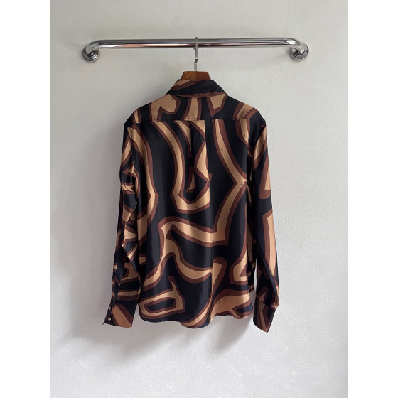 Pucci silk shirt features Labirinto print and is made of 100% heavyweight silk twill. Size options: 36, 38, 40, 42