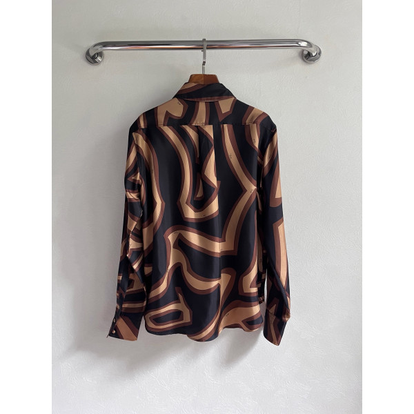 Pucci silk shirt features Labirinto print and is made of 100% heavyweight silk twill. Size options: 36, 38, 40, 42