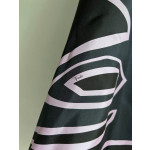 Pucci silk halter top with print, made of 100% silk twill, featuring a signature geometric swirl print all over. It has a halter neckline, a backless design with lace-up details, and each printed piece is unique.