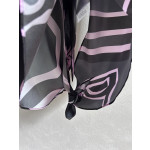 Pucci silk halter top with print, made of 100% silk twill, featuring a signature geometric swirl print all over. It has a halter neckline, a backless design with lace-up details, and each printed piece is unique.