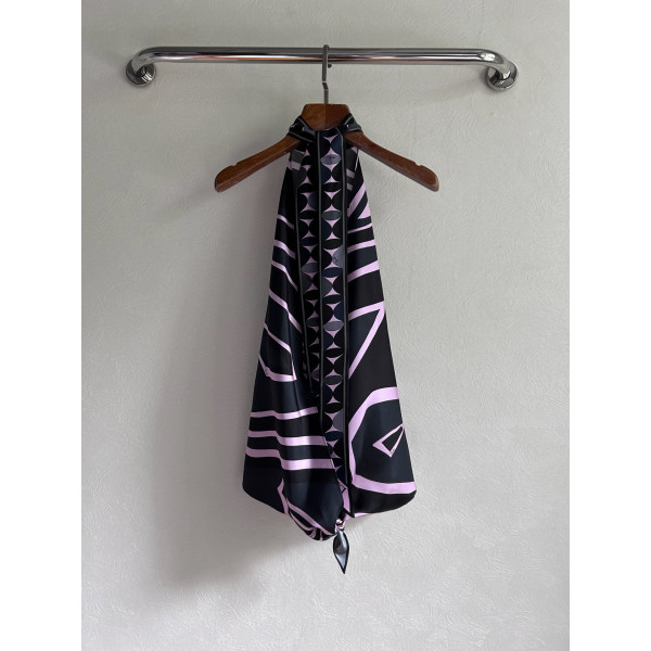 Pucci silk halter top with print, made of 100% silk twill, featuring a signature geometric swirl print all over. It has a halter neckline, a backless design with lace-up details, and each printed piece is unique.
