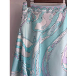 Pucci irregular silk skirt, made of 100% twill silk, features a signature geometric swirl print throughout the entire body, with the "Orchidee" print covering the entire body. The asymmetric skirt comes in sizes 36, 38, 40, and 42