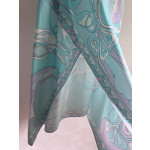 Pucci irregular silk skirt, made of 100% twill silk, features a signature geometric swirl print throughout the entire body, with the "Orchidee" print covering the entire body. The asymmetric skirt comes in sizes 36, 38, 40, and 42