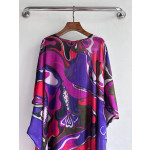 Pucci smock dress made of 100% lightweight cotton, featuring a round neck, tie-back straps, a loose silhouette, and Orchidee multi-color printing