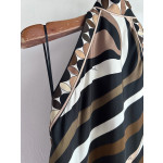 Pucci silk halter dress features the classic "Marmo" swirl pattern surrounding print. This mid-length dress is made of heavyweight twill silk satin. Size options: 36, 38, 40, 42