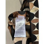 Pucci silk halter dress features the classic "Marmo" swirl pattern surrounding print. This mid-length dress is made of heavyweight twill silk satin. Size options: 36, 38, 40, 42