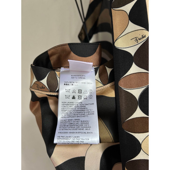 Pucci silk halter dress features the classic "Marmo" swirl pattern surrounding print. This mid-length dress is made of heavyweight twill silk satin. Size options: 36, 38, 40, 42
