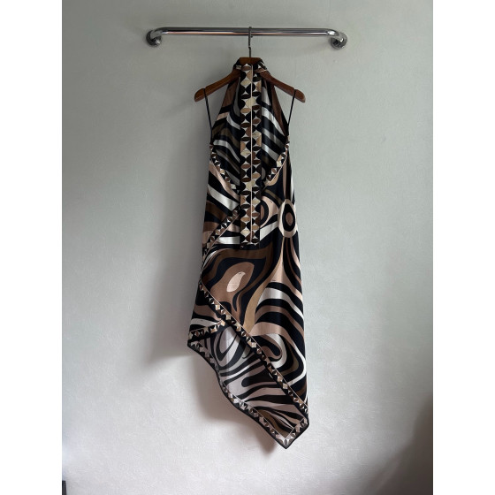 Pucci silk halter dress features the classic "Marmo" swirl pattern surrounding print. This mid-length dress is made of heavyweight twill silk satin. Size options: 36, 38, 40, 42