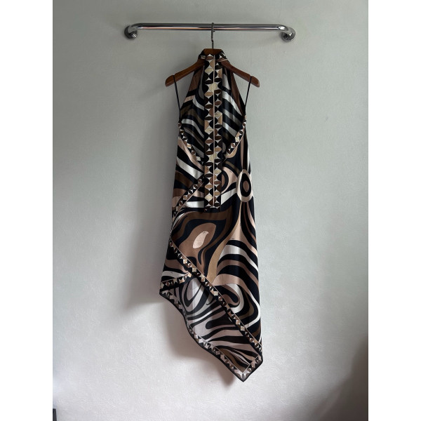 Pucci silk halter dress features the classic "Marmo" swirl pattern surrounding print. This mid-length dress is made of heavyweight twill silk satin. Size options: 36, 38, 40, 42
