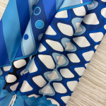 Pucci's blues silk floral print suit, made of 100% aligned silk, boasts a sleek and draping texture. The cool blues contrast with other colors, exuding a vintage artistic vibe