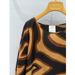 Pucci Silk Caftan Dress ✨ Crafted from premium 100% silk twill, adorned with black‑and‑gold Labirinto print. Features a roomy silhouette and cape‑style sleeves that tie at the wrists.  Size: One‑size‑fits‑all