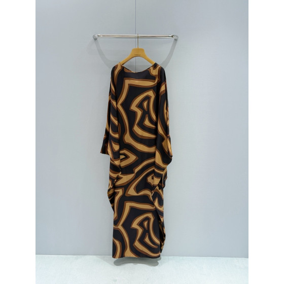 Pucci Silk Caftan Dress ✨ Crafted from premium 100% silk twill, adorned with black‑and‑gold Labirinto print. Features a roomy silhouette and cape‑style sleeves that tie at the wrists.  Size: One‑size‑fits‑all